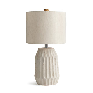 Table lamp with natural white pitted texture base and natural shade