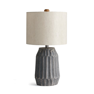 Table lamp with natural gray pitted texture base and natural shade