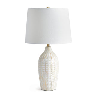 Table lamp with pressed pattern on ceramic base and white fabric shade